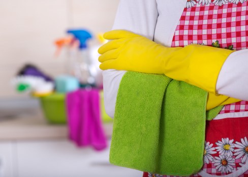 Team member following hygiene and safety procedures during cleaning