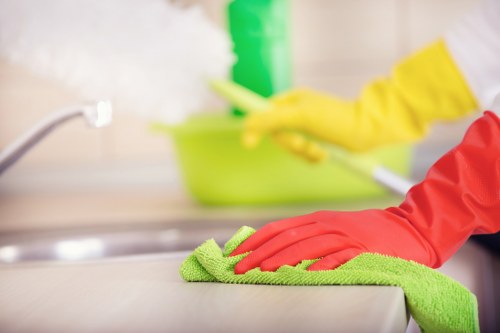 Local upholstery cleaner treating a sofa in Camden